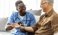 male-nurse-checks-man-blood-pressure-800x533
